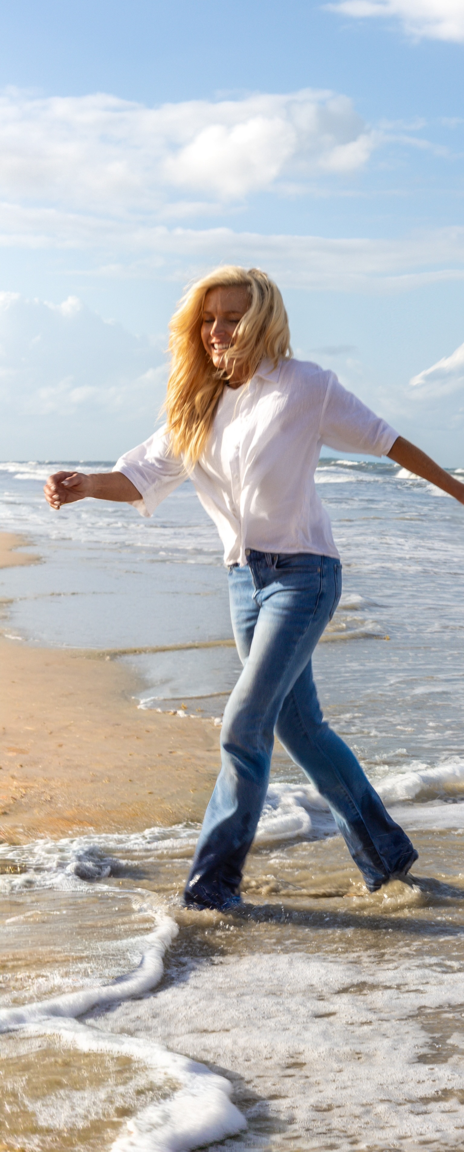 Sherry smiling at the beach